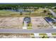 A home overlooking a golf course and pond, surrounded by a well-manicured lawn and neighborhood amenities at 1262 Champions Dr, Daytona Beach, FL 32124