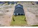 Aerial view of a home with a well-manicured lawn, covered patio, and new landscaping in a quiet neighborhood at 1262 Champions Dr, Daytona Beach, FL 32124