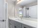 Bathroom vanity with gray cabinets and quartz countertop at 1262 Champions Dr, Daytona Beach, FL 32124