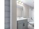Bright bathroom features a single sink vanity with modern fixtures and a spacious walk-in closet at 1262 Champions Dr, Daytona Beach, FL 32124