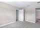 An empty bedroom features an open door leading to another room at 1262 Champions Dr, Daytona Beach, FL 32124