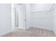 An empty bedroom features an open door with closet and bathroom access at 1262 Champions Dr, Daytona Beach, FL 32124