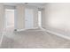 An empty bedroom features white trim and a neutral color palette at 1262 Champions Dr, Daytona Beach, FL 32124