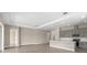 Modern kitchen with gray cabinetry, an island with a breakfast bar, and open floor plan at 1262 Champions Dr, Daytona Beach, FL 32124
