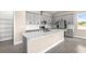 Kitchen showcasing quartz countertops, gray cabinets and stainless steel appliances at 1262 Champions Dr, Daytona Beach, FL 32124