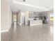 Spacious area showing tiled floors, access to front door and the kitchen area at 1262 Champions Dr, Daytona Beach, FL 32124