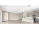 Open-concept living room area near the kitchen with lots of natural light at 1262 Champions Dr, Daytona Beach, FL 32124