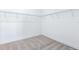 A walk-in closet features white walls and wire shelving at 1262 Champions Dr, Daytona Beach, FL 32124
