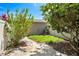 Charming backyard featuring lush foliage, a small lawn, and a paved patio area at 12963 Garridan Ave, Windermere, FL 34786