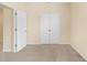 Bedroom with plush carpet, a large closet, and a neutral color scheme at 12963 Garridan Ave, Windermere, FL 34786