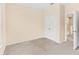 Neutral bedroom with carpet, closet, and neutral walls, bathed in the soft glow of natural light at 12963 Garridan Ave, Windermere, FL 34786