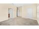 Bedroom with plush carpet and three doors: closet, bathroom and hallway at 12963 Garridan Ave, Windermere, FL 34786