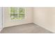Light and bright bedroom with carpet flooring, a large window, and neutral walls at 12963 Garridan Ave, Windermere, FL 34786