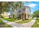 Charming townhome with a landscaped front yard, sidewalk, and inviting entryway, perfect for a modern Gathering at 12963 Garridan Ave, Windermere, FL 34786