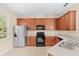 Well-equipped kitchen featuring stainless steel appliances, ample counter space, tile flooring, and lots of natural light at 12963 Garridan Ave, Windermere, FL 34786
