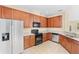 Bright kitchen featuring stainless steel appliances, ample counter space, and tile flooring at 12963 Garridan Ave, Windermere, FL 34786