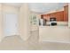 Kitchen area with tile floors, stainless steel appliances and access to the front entrance at 12963 Garridan Ave, Windermere, FL 34786