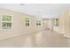 Bright, open living room featuring tile flooring, neutral paint, and large windows at 12963 Garridan Ave, Windermere, FL 34786