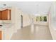 Open living room area with lots of natural light coming from the windows and tile flooring at 12963 Garridan Ave, Windermere, FL 34786