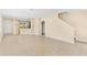 Open-concept living room with tile floors, neutral walls, and staircase access at 12963 Garridan Ave, Windermere, FL 34786