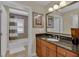 Bathroom with granite countertop vanity and shower with patterned shower curtain at 1354 Centre Court Ridge Dr # 104, Reunion, FL 34747