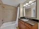 Full bathroom featuring a tub and shower combination with a large vanity at 1354 Centre Court Ridge Dr # 104, Reunion, FL 34747