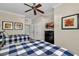 Bedroom with two beds with matching blue and white bedding, ceiling fan and wall decor at 1354 Centre Court Ridge Dr # 104, Reunion, FL 34747