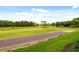 The property offers scenic views of the lush green golf course and surrounding greenery at 1354 Centre Court Ridge Dr # 104, Reunion, FL 34747