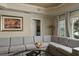Bright living room featuring a comfortable sectional sofa and stylish decor at 1354 Centre Court Ridge Dr # 104, Reunion, FL 34747