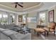 Spacious living room boasts a cozy seating area, recessed ceiling, and abundant natural light at 1354 Centre Court Ridge Dr # 104, Reunion, FL 34747