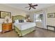 Inviting bedroom with a plush headboard, hardwood floors, and natural light from the large window at 1354 Centre Court Ridge Dr # 104, Reunion, FL 34747