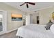 Comfortable bedroom with modern media display, and large window at 1354 Centre Court Ridge Dr # 104, Reunion, FL 34747