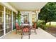 Covered patio with tile flooring and elegant outdoor furniture is ideal for relaxing or entertaining guests at 1354 Centre Court Ridge Dr # 104, Reunion, FL 34747