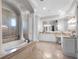 A spacious bathroom with tiled floors, soaking tub, and white cabinetry at 1417 Terralago Pl, Oviedo, FL 32765