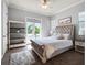 Comfortable bedroom featuring a plush bed, bookshelf, and balcony access at 1417 Terralago Pl, Oviedo, FL 32765