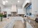 Elegant kitchen with granite counters, stainless appliances, and a large island with a sink at 1417 Terralago Pl, Oviedo, FL 32765