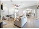Spacious living room showcasing an open layout with seamless flow into the kitchen and staircase at 1417 Terralago Pl, Oviedo, FL 32765