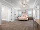 Spacious main bedroom featuring a tray ceiling, carpet, and lots of natural light at 1417 Terralago Pl, Oviedo, FL 32765