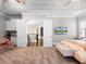 A spacious main bedroom with seating area, wet bar, and access to upstairs landing at 1417 Terralago Pl, Oviedo, FL 32765