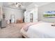 Cozy main bedroom with plush carpeting, light walls, and a tray ceiling at 1417 Terralago Pl, Oviedo, FL 32765