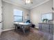 A simple office space with a desk, drawers, and natural light at 1417 Terralago Pl, Oviedo, FL 32765