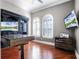 Bright home office with built-in desk, providing an ideal workspace with natural light at 1417 Terralago Pl, Oviedo, FL 32765