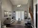 Elegant living room with vaulted ceilings, contemporary decor, and ample natural light at 1445 Valley Pine Cir, Apopka, FL 32712