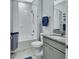 Bathroom featuring a shower-tub combo with white tile and a stylish granite vanity at 1580 Delphi Way, New Smyrna Beach, FL 32168
