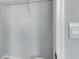 This walk in closet has white walls, wire racks for storage and a light switch at 1580 Delphi Way, New Smyrna Beach, FL 32168