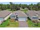 Beautiful one-story home with well-maintained landscaping, paver driveway, and attached two-car garage at 1580 Delphi Way, New Smyrna Beach, FL 32168