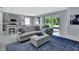 Open-concept living space flows to a covered patio, creating a seamless indoor-outdoor experience at 1580 Delphi Way, New Smyrna Beach, FL 32168
