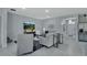 The airy living room with modern furnishings features abundant natural light and stylish decor at 1580 Delphi Way, New Smyrna Beach, FL 32168
