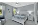 Serene bedroom with soft lighting, ceiling fan, and neutral tones for a peaceful retreat at 1580 Delphi Way, New Smyrna Beach, FL 32168