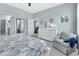 Beautiful bedroom with a comfortable sitting area, a serene atmosphere, and en-suite bathroom at 1580 Delphi Way, New Smyrna Beach, FL 32168